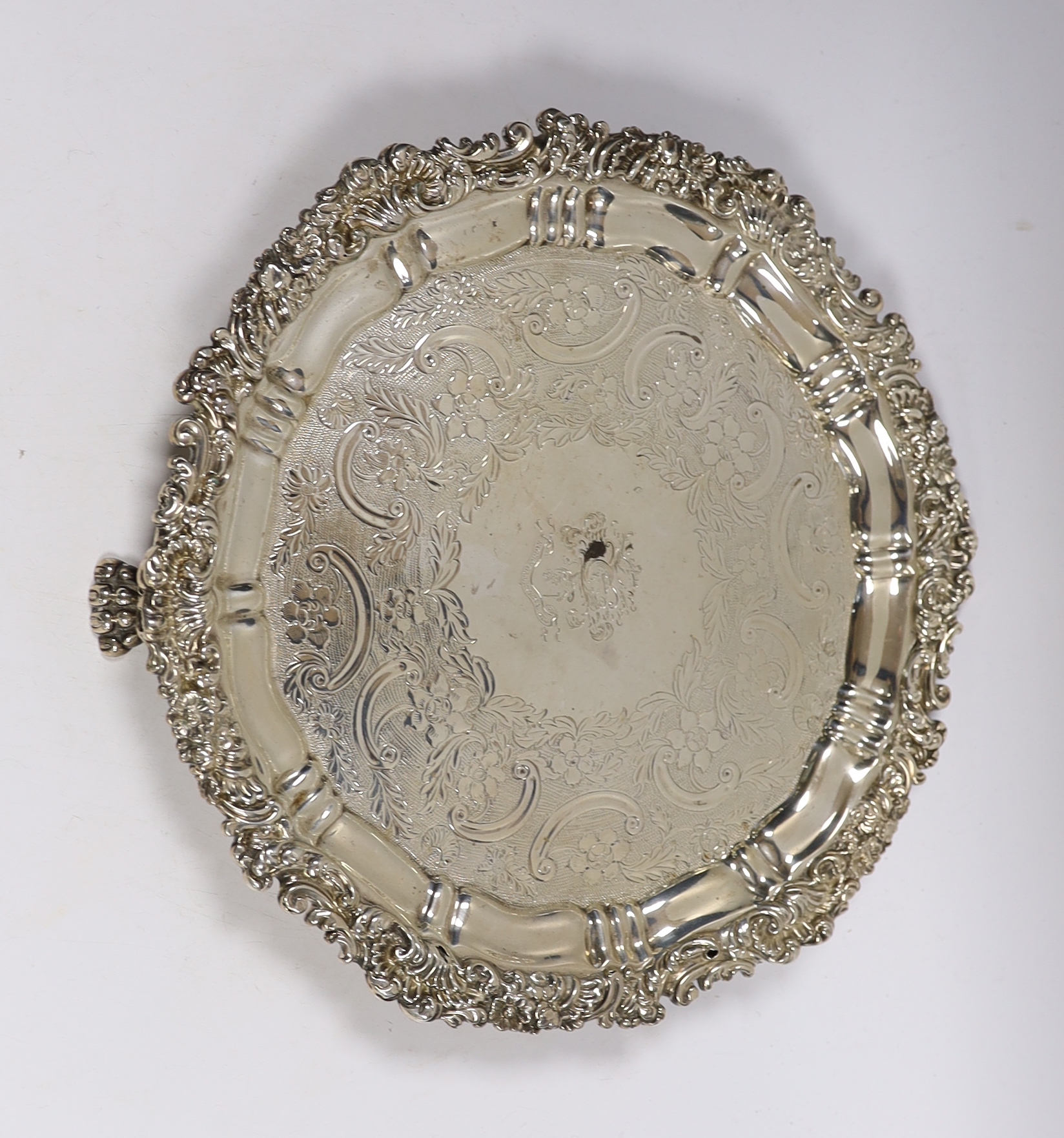 An early 19th century engraved silver salver, marks rubbed, 30.8cm, 26oz.